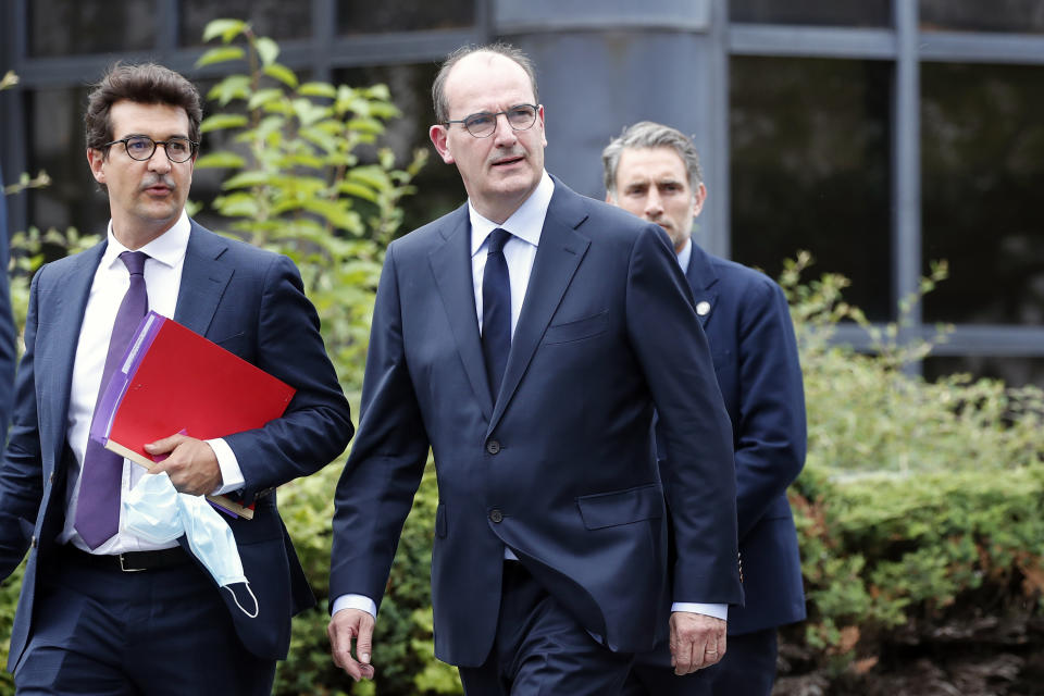 France's new prime minister Jean Castex arrives for a press conference after he made his first outing in the new job in X-FAB, a semiconductor factory that received extensive government aid to withstand the virus lockdown on its activity in Le Coudray Montceaux, near Paris, Saturday, July 4, 2020. His office chose the X-FAB factory because it's seen as an example of European cooperation and innovation, and the kind of company that will be important to pulling France of out of deep recession and reviving its industrial production. (AP Photo/Francois Mori)