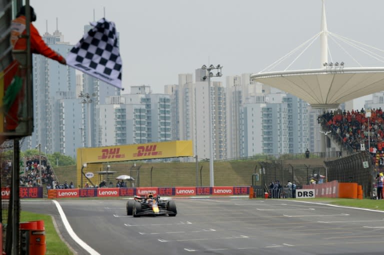 Red Bull Racing's Dutch driver Max Verstappen takes the chequered flag in Shanghai (Andres Martinez Casares)