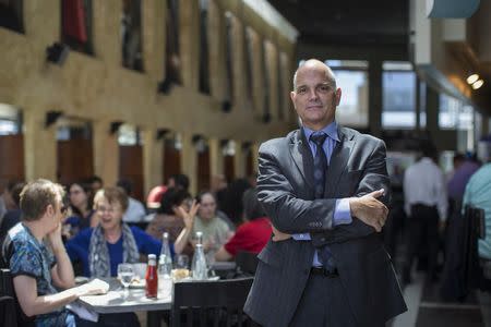 Director of operations Adam Lewis poses for a photo at Kate Mantilini restaurant in Beverly Hills, California June 4, 2014. REUTERS/Mario Anzuoni