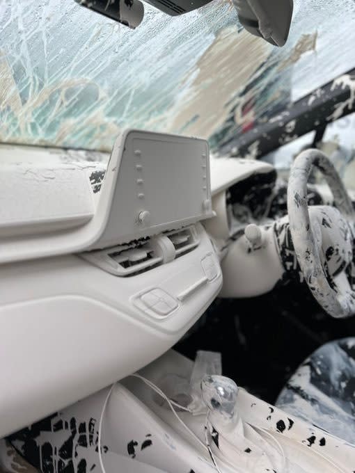 The dashboard of the car ended up being covered in paint