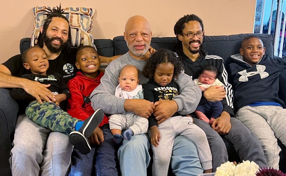 In 35 years as an independent journalist, Leland Stein III (center) has covered 29 Super Bowls, 27 Final Fours, 23 NBA All-Star Games, four Summer Olympics and much more. But he says his number one team has always been his family, which includes Leland IV to his left, his youngest son, Leighton, to his right and six grandsons.