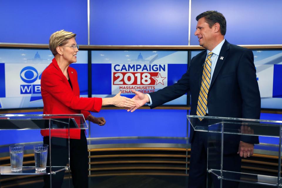 Massachusetts Senate candidates Sen. Elizabeth Warren, left, and her opponent State Rep. Geoff Diehl shake hands before a debate in Boston, Friday, Oct. 19, 2018. (AP Photo/Michael Dwyer)