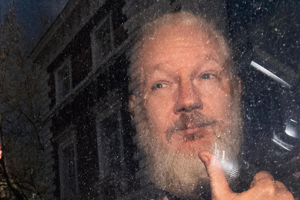 Julian Assange arrives at Westminster Magistrates' Court in London, after the WikiLeaks founder was arrested by officers from the Metropolitan Police and taken into custody following the Ecuadorian government's withdrawal of asylum.