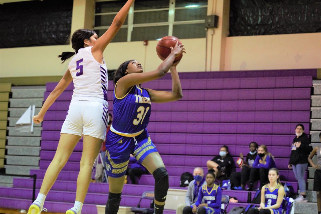 Martin County's Kiosha Smith goes in for a layup against Okeechobee in Jan. 2021.