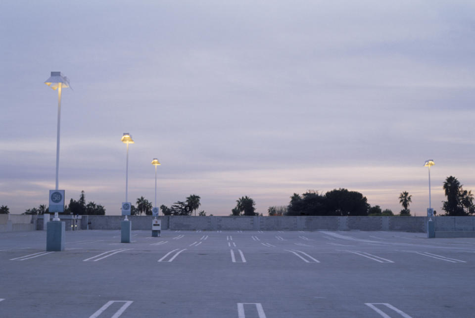 an empty parking lot at dusk