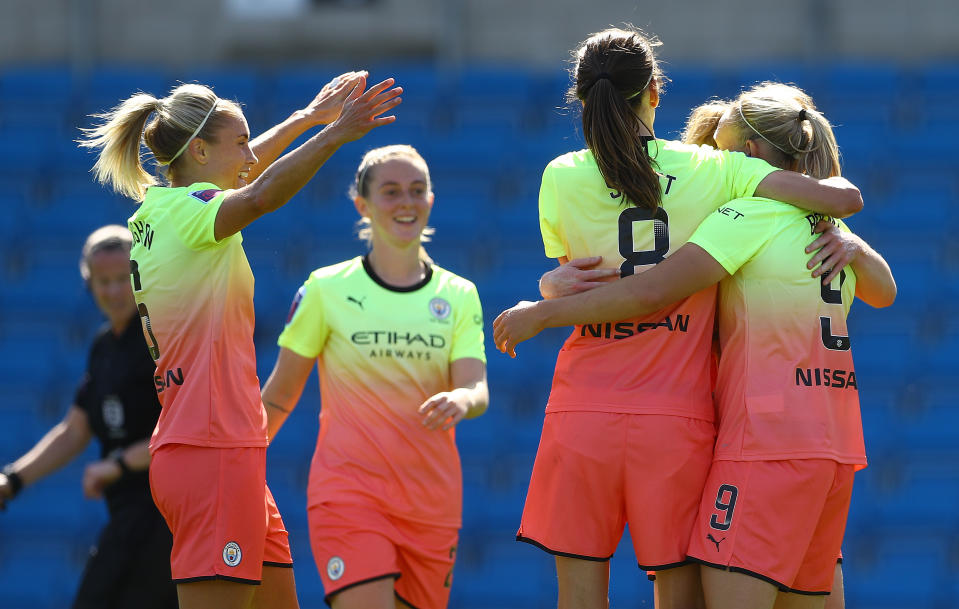 Pauline Bremer celebrates scoring with her City teammates 