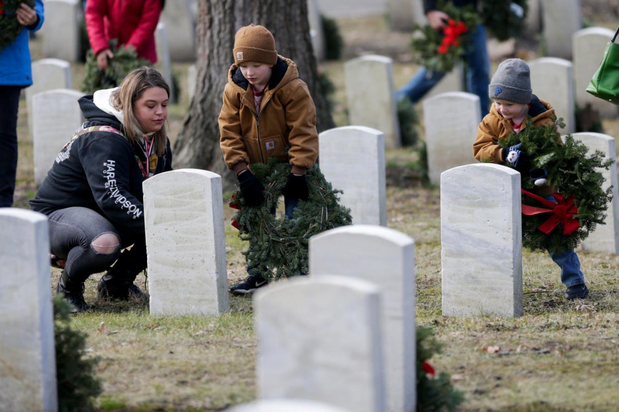 Wreaths are placed at the headstones around the Indiana Veterans' Home cemetery, Saturday, Dec. 14, 2019 in West Lafayette.