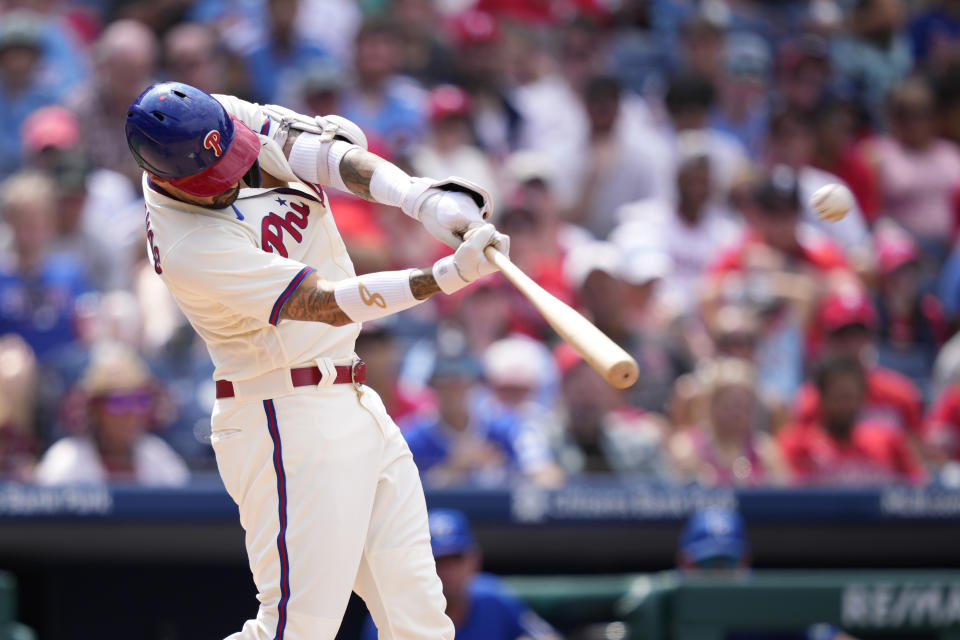 Philadelphia Phillies' Nick Castellanos hits a two-run home run against Kansas City Royals pitcher Jonathan Heasley during the fifth inning of a baseball game, Sunday, Aug. 6, 2023, in Philadelphia. (AP Photo/Matt Slocum)