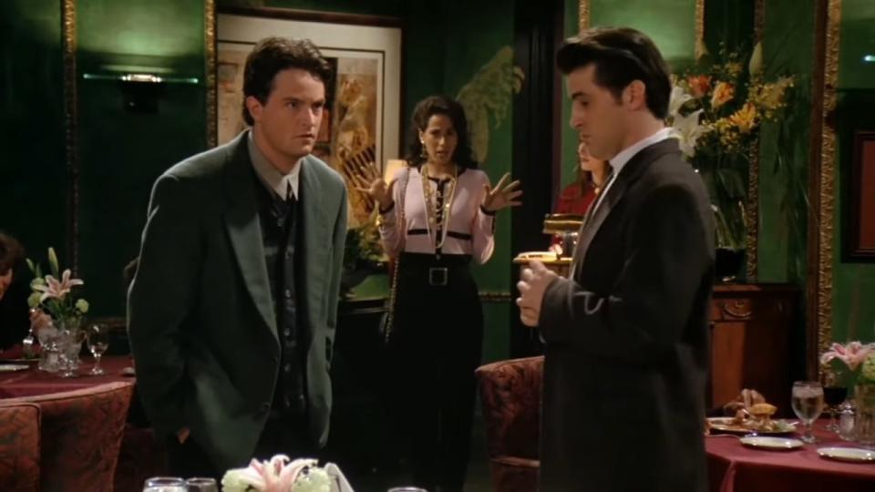 Joey and Chandler with Janice in the background in "Friends"