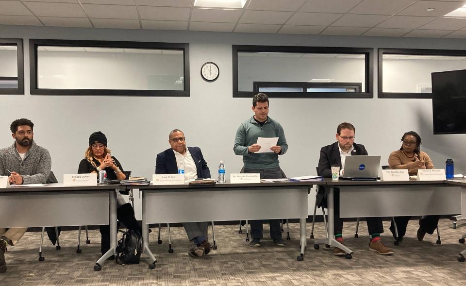 Erie County Diversity, Equity and Inclusion Commission Chairman Ricardo Escajadillo, standing, reads a unity statement at March 30, 2023, meeting. From left are board members Jonathan Atkinson, Brandy Cortes, Chief Administrative Officer Gary Lee, Escajadillo, Solicitor Tim Wachter and administrative assistant Devan Mitchell.