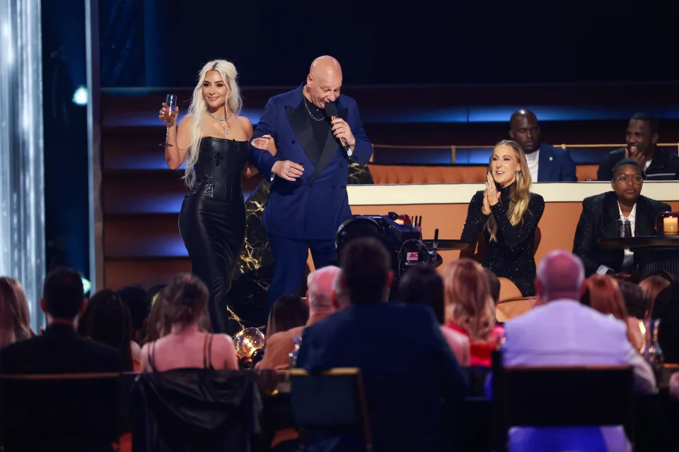 Kim Kardashian and Jeff Ross onstage.