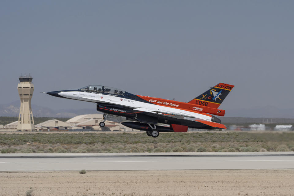 The X-62A VISTA aircraft, an experimental AI-enabled Air Force F-16 fighter jet, takes off on Thursday, May 2, 2024, at Edwards Air Force Base, Calif. The flight, with Air Force Secretary Frank Kendall riding in the front seat, is serving as a public statement of confidence in the future role of AI in air combat. The military is planning to use the technology to operate an unmanned fleet of 1,000 aircraft. (AP Photo/Damian Dovarganes)