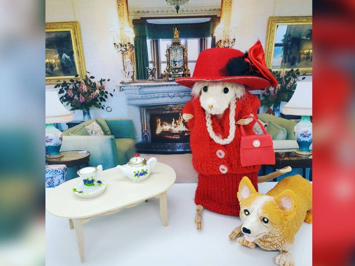 Kamloops-born taxidermy artist Madi Lowe created this tribute to the late Queen Elizabeth II, donning a red dress Lowe sewed herself, and an accompanying corgi. (Submitted by Madi Lowe - image credit)