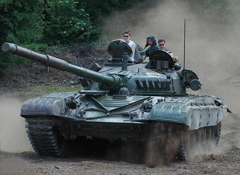 a group of people on a tank