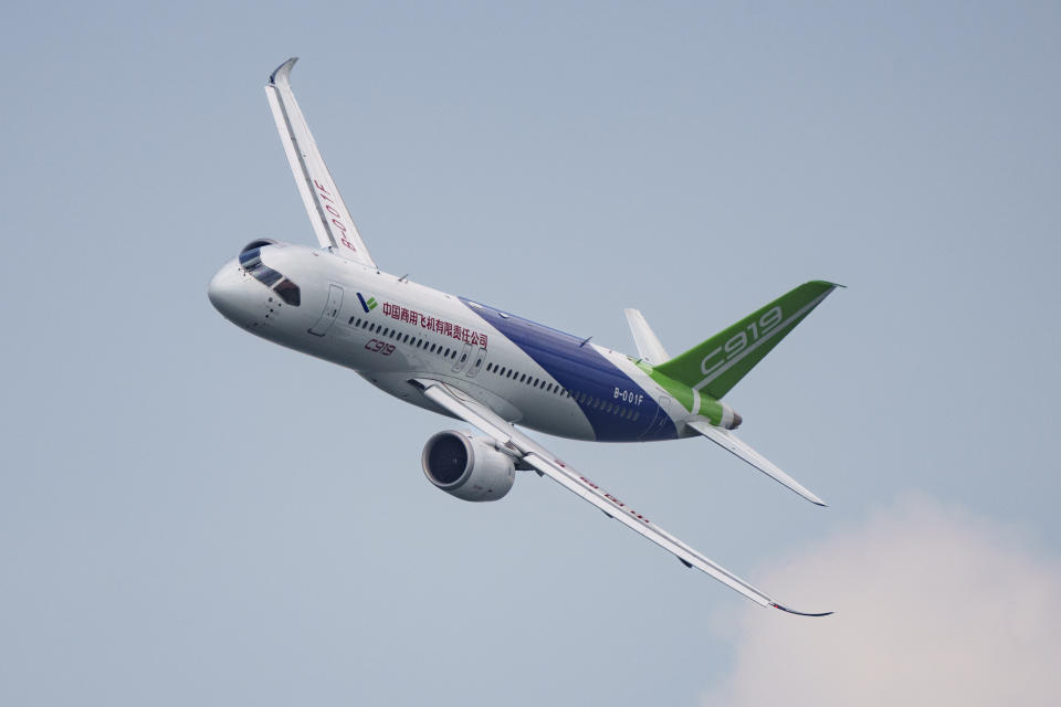 A China's COMAC C919 aircraft flies during the first day of the Singapore Airshow in Singapore, Tuesday, Feb. 20, 2024. (AP Photo/Vincent Thian)