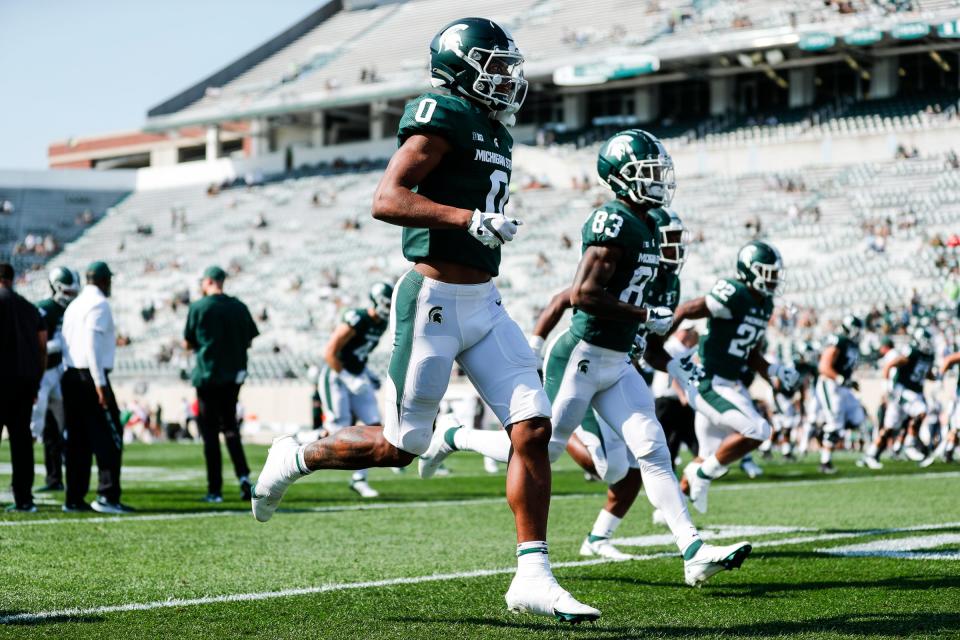 Michigan State wide receiver Keon Coleman (0) and  wide receiver Montorie Foster (83) during warm up before the Youngstown State game at Spartan Stadium in East Lansing on Saturday, Sept. 11, 2021.