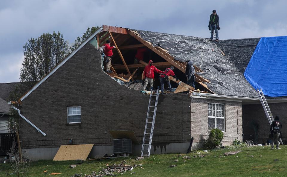 Repair work begins at several homes in the Utica area off I-265 after the wind damage from Tuesday's tornado that hit parts of Southern Indiana and the Louisville metro area. Many homes were damaged. April 3, 2024