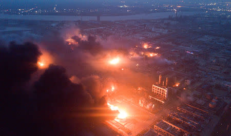 Smoke billows from fire following an explosion at the pesticide plant owned by Tianjiayi Chemical, in Xiangshui county, Yancheng, Jiangsu province, China March 21, 2019. Picture taken March 21, 2019. REUTERS/Stringer