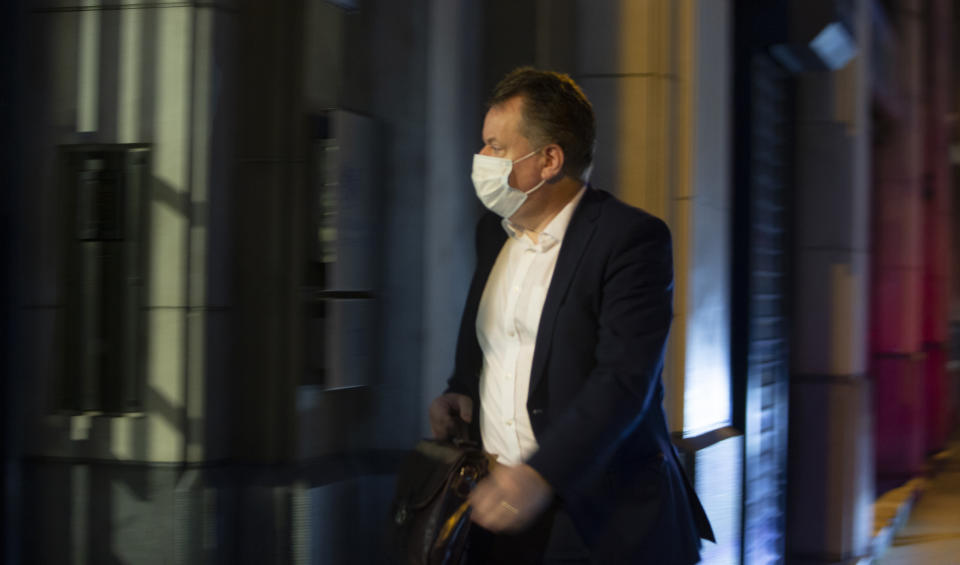 Britain's chief negotiator David Frost arrives at the UK Mission to the EU in Brussels, Wednesday, Dec. 23, 2020. Talks continued Wednesday in the bid to put a trade deal between the European Union and the United Kingdom, before a Brexit transition period ends on New Year's Day, with the EU legislature insisting it will not have time to approve a deal. (AP Photo/Virginia Mayo)