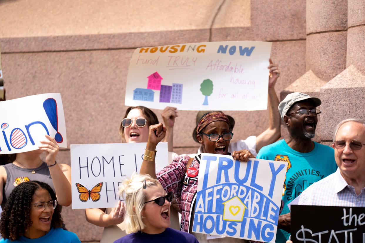 Supporters of a charter amendment that would raise Cincinnati's earned income tax to fund affordable housing for the city's poorest residents rallied outside City Hall in August.