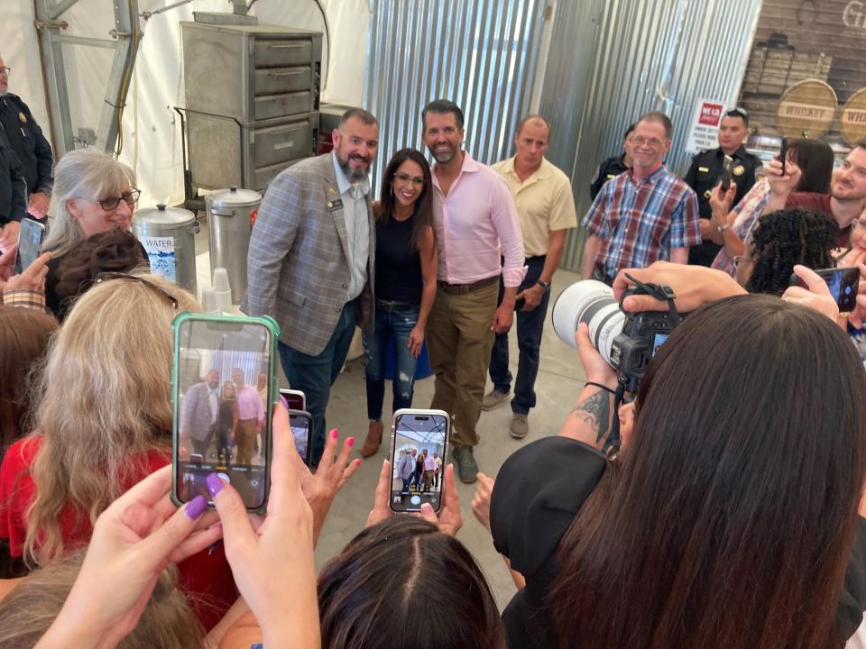 State Rep. Ty Winter poses for a photo with U.S. Rep. Lauren Boebert and Donald Trump Jr. at the Freedom Fest fundraiser hosted by the Pueblo County Republican Party at the state fairgrounds on July 8, 2023.