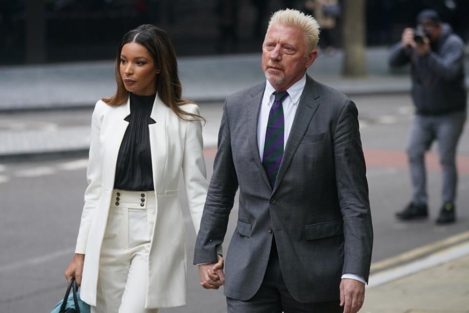 Three-time Wimbledon champion Boris Becker arrives alongside partner Lilian de Carvalho Monteiro for sentencing at Southwark Crown Court (Victoria Jones/PA) (PA Wire)