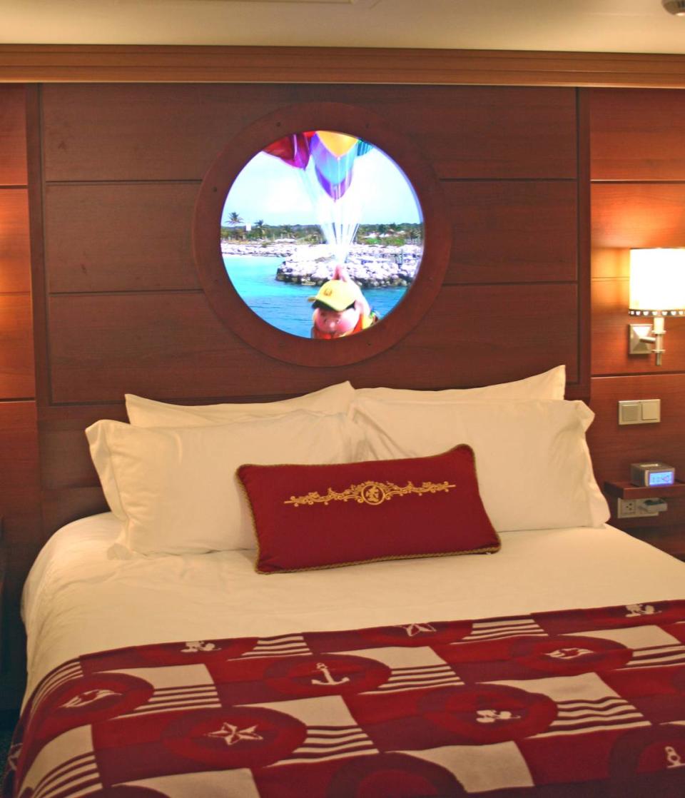 A “magic porthole” on a windowless inside cabin on the Disney Dream shows streaming video of the view outside the ship - here, Castaway Cay in the Bahamas - as Russell, a character from the film “Up,” floats across the screen.