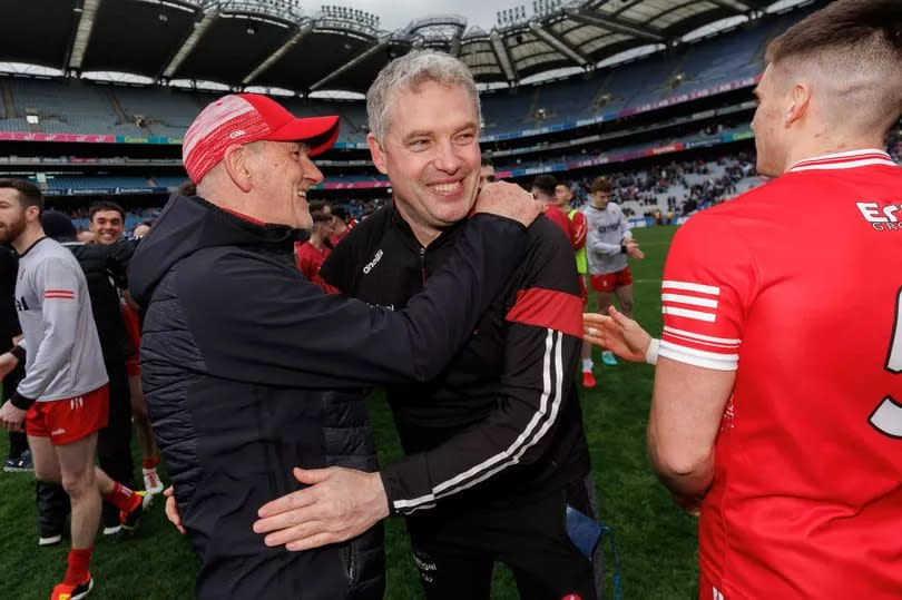 Derry’s manager Mickey Harte celebrates with Gavin Devlin after the Division One final win over Dublin in Croke Park