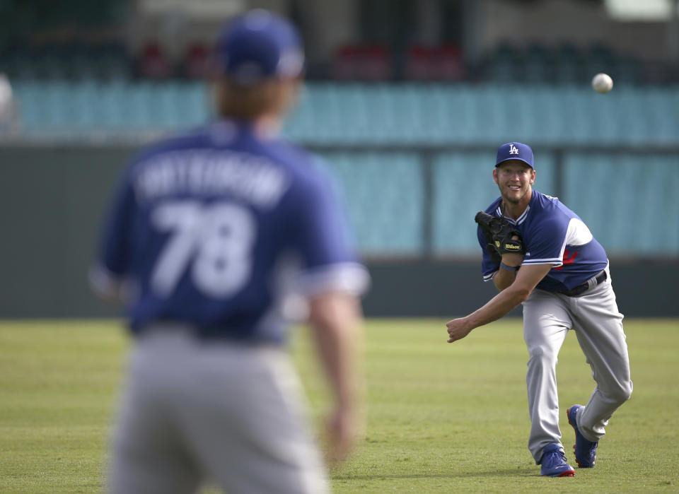 The Los Angeles Dodgers' Clayton Kershaw throws as his team trains at the Sydney Cricket Ground in Sydney, Tuesday, March 18, 2014. The MLB season-opening two-game series between the Los Angeles Dodgers and Arizona Diamondbacks in Sydney will be played this weekend. (AP Photo/Rick Rycroft)