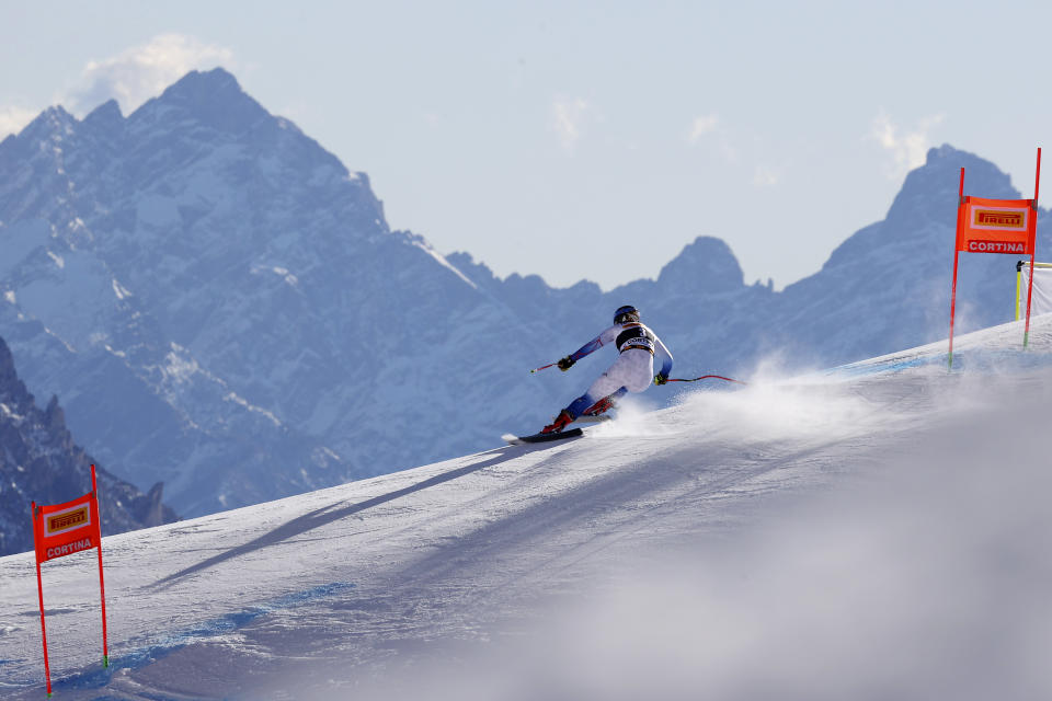 United States' Breezy Johnson speeds down the course during an alpine ski, women's World Cup downhill training, in Cortina d'Ampezzo, Italy, Friday, Jan. 21, 2022. (AP Photo/Alessandro Trovati)