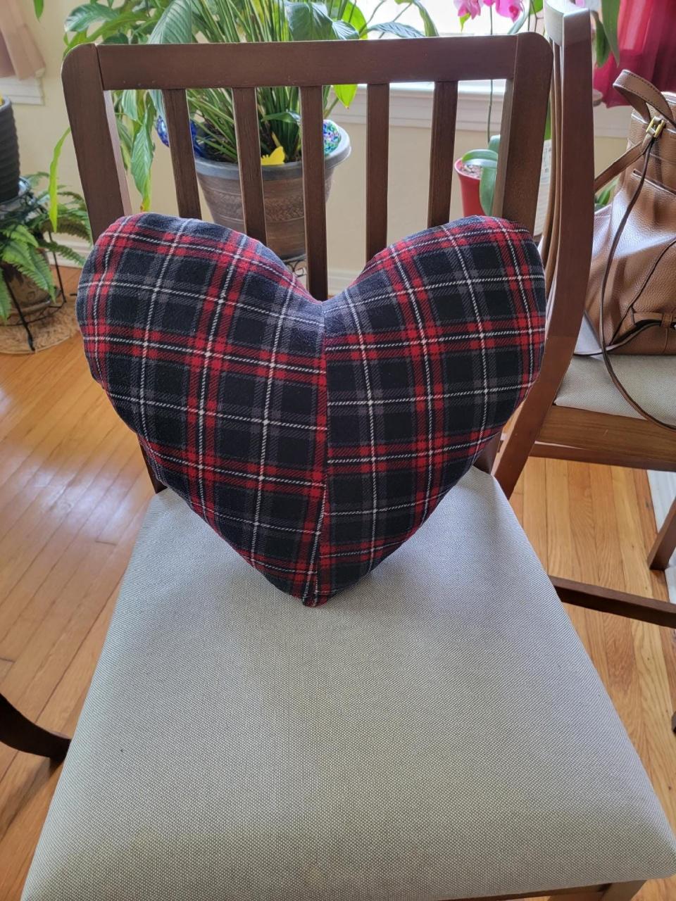 Pat Hemsley, a volunteer for Community Hospice, made this "memory pillow" for the family of Charles McVey, who died in April. One side is made from his favorite pajamas, and the other side is part of an old pocket T-shirt, the kind he wore during a long career as a trucker.