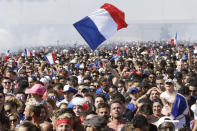 <p>French soccer fans watch a live broadcast on a big screen of the final match between France and Croatia at the 2018 soccer World Cup, in Marseille, southern France, Sunday, July 15, 2018. (AP Photo/Claude Paris) </p>