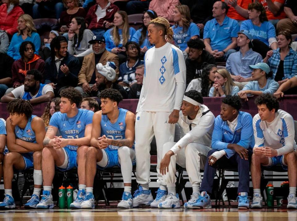 North Carolina’s Armando Bacot (5) watches the second half against Virginia Tech from the bench on Sunday, December 4, 2022 at Cassell Coliseum in Blacksburg, Va. Bacot did not play, due to an injury.