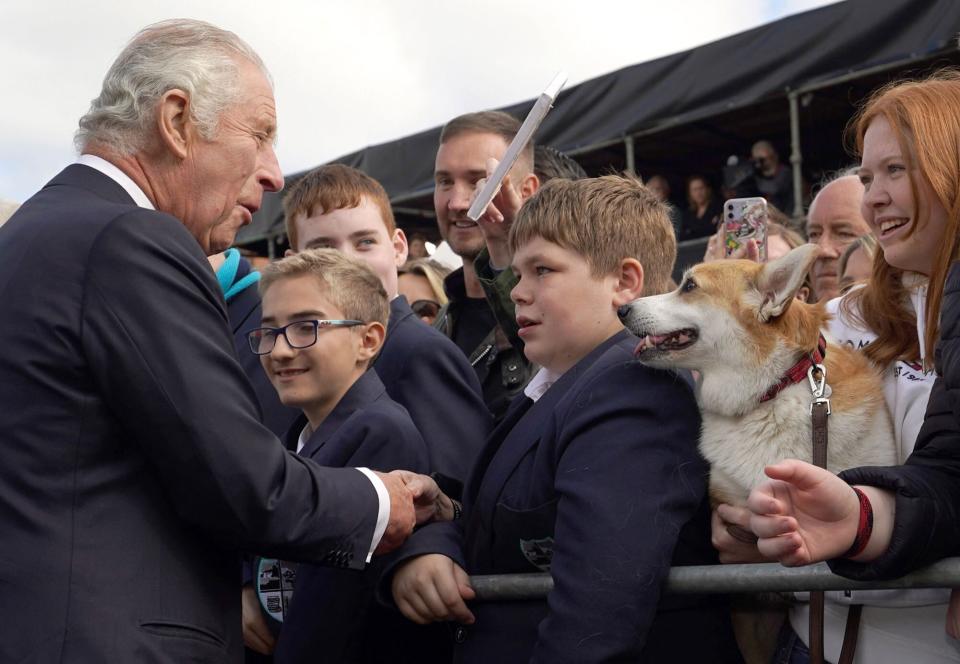 Britain's King Charles III greets wellsishers as he arrives at Hillsborough Castle in Belfast on September 13, 2022, during his visit to Northern Ireland. - King Charles III on Tuesday travelled to Belfast where he is set to receive tributes from pro-UK parties and the respectful sympathies of nationalists who nevertheless can see reunification with Ireland drawing closer. (Photo by Niall Carson / POOL / AFP) (Photo by NIALL CARSON/POOL/AFP via Getty Images)