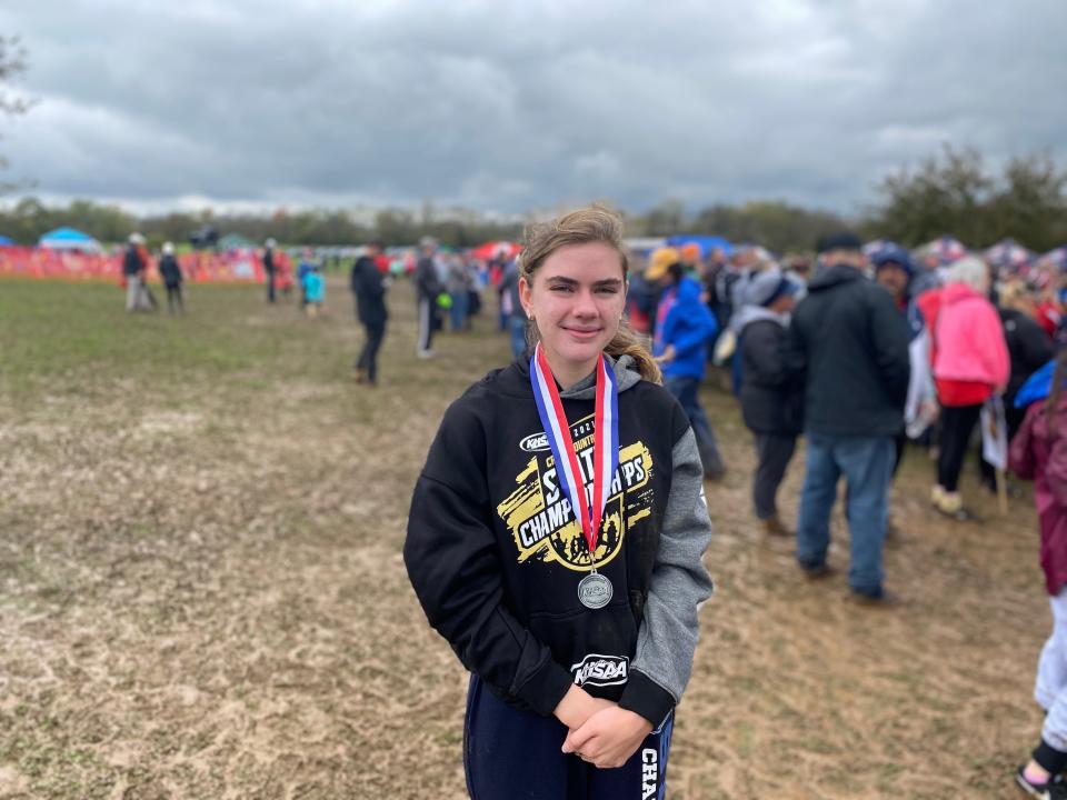 Kentucky Country Day cross country runner Haley Schoenegge poses after receiving her state-runner up medal at the Class A state meet at Bourbon County Cross Country Course on Oct. 30 2021