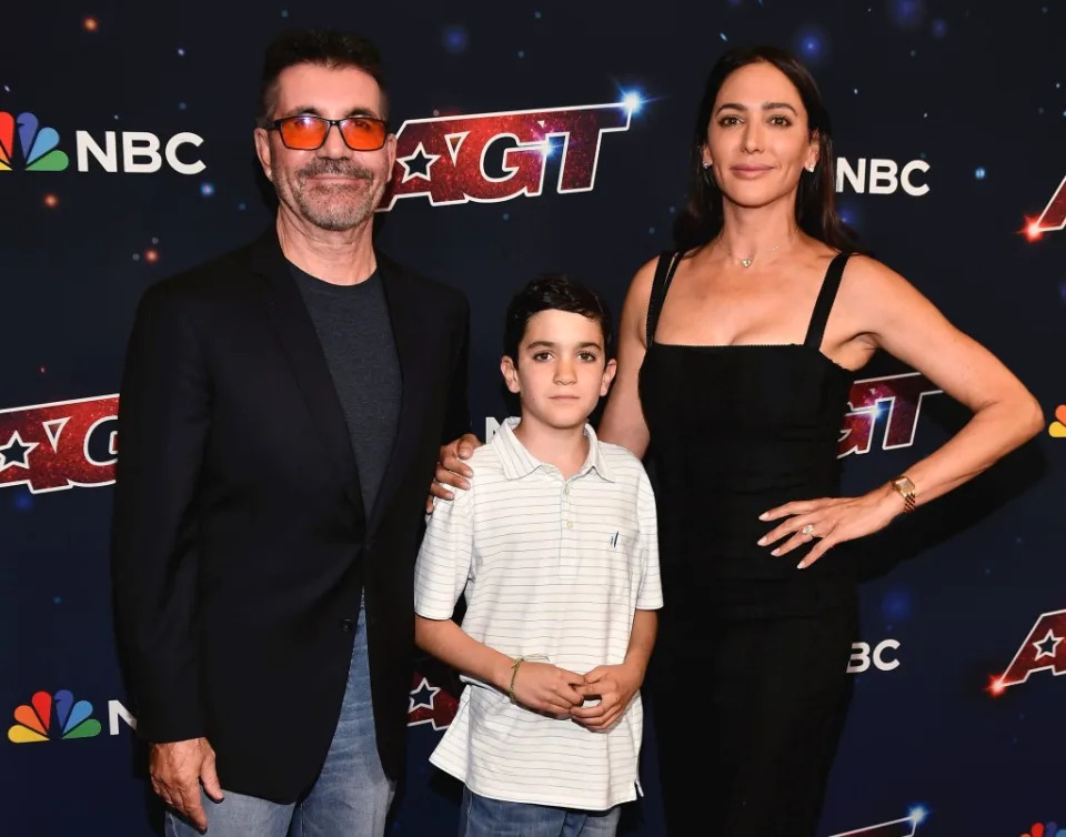 Simon Cowell with son, Eric Cowell, and partner, Lauren Silverman. Scott Kirkland/Shutterstock