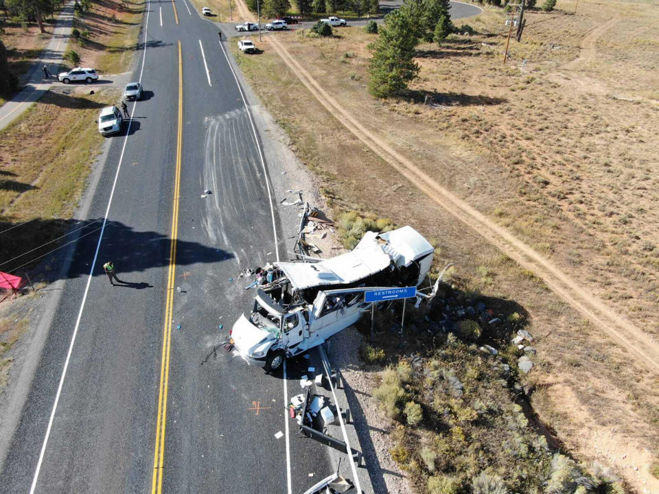 This photo provided by the Utah Highway Patrol shows a tour bus carrying Chinese-speaking tourists after it crashed near Bryce Canyon National Park in southern Utah, killing at least four people and critically injuring multiple others, Friday, Sept. 20, 2019. (Utah Highway Patrol via AP)