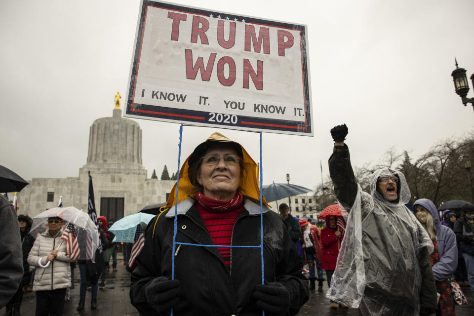A protester outside the Oregon state capitol in Salem, where demonstrators breached the legislative building in December. The FBI has warned local law enforcement agencies that potentially violent protests could occur in state capitals nationwide in the days before President-elect Joe Biden is inaugurated on Jan. 20. (Photo: (AP Photo/Paula Bronstein, File))