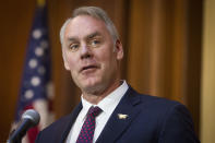 FILE - In this Dec. 11, 2018 file photo, Secretary of the Interior Ryan Zinke speaks after an order withdrawing federal protections for countless waterways and wetland was signed, at EPA headquarters in Washington. Trump says on Saturday, Dec. 15, Zinke leaving administration at end of year, successor to be announced next week.(AP Photo/Cliff Owen)