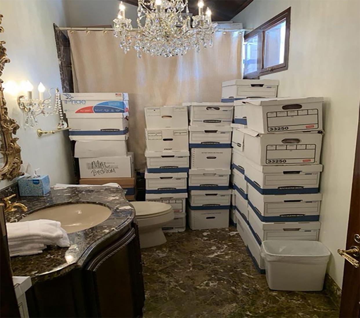 In this handout photo provided by the U.S. Department of Justice, stacks of boxes can be observed in a bathroom and shower in The Mar-a-Lago Club’s Lake Room at former U.S. President Donald Trump's Mar-a-Lago estate in Palm Beach, Florida. Former President Donald Trump has been indicted on 37 felony counts in the special counsel's classified documents probe.