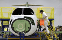 This July 30, 2019 shows a HondaJet Elite aircraft in production at the Honda Aircraft Co. headquarters in Greensboro, N.C. Nearly four years after delivering its first jet, Honda is facing decisions as the company better known for cars and lawnmowers considers whether to sink billions more into its decades-in-the-making aircraft division. (AP Photo/Gerry Broome)