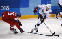 FILE - Ryan Donato (16), of the United States, skates with the puck past Dominik Kubalik (18), of the Czech Republic, during the second period of the quarterfinal round of the men's hockey game at the 2018 Winter Olympics in Gangneung, South Korea, Wednesday, Feb. 21, 2018. USA Hockey and Hockey Canada are eyeing several college players to play at the Olympics after the NHL decided not to participate in Beijing. Anaheim’s Troy Terry, Minnesota’s Jordan Greenway and Seattle’s Ryan Donato played for the U.S. in Pyeongchang. They are major proponents of college players taking the chance, even if it means missing part of the NCAA season. (AP Photo/Jae C. Hong, File)