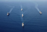 U.S. Navy vessels including the USS Wasp (L), USS Kearsarge (R), USS Oak Hill (front), SS Wright (C) and USNS William McLean (back) maneuver in formation as they skirt around Hurricane Maria before eventually returning to assist the U.S. Virgin Islands, in the Caribbean Sea September 19, 2017. REUTERS/Jonathan Drake