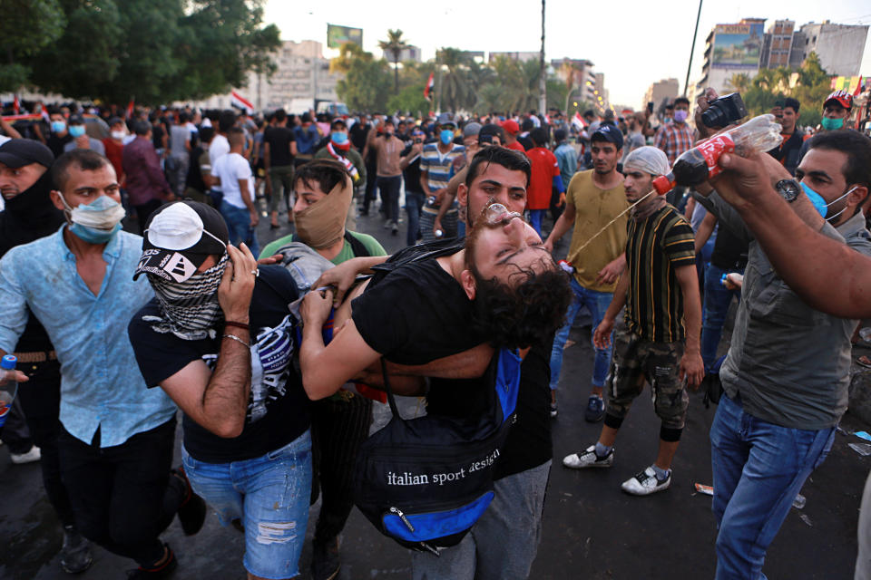 An injured protestor is rushed to a hospital during a demonstration in Baghdad, Iraq, Saturday, Oct. 26, 2019. Iraqi protesters converged on the central square in the capital Baghdad on Saturday as security forces erected blast walls to prevent them from reaching a heavily fortified government area after a day of violence that killed scores. (Photo: Khalid Mohammed/AP)