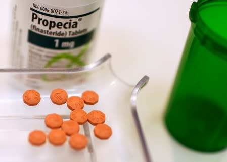 A bottle of Propecia is seen on a pharmacy shelf in New York