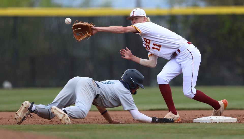 Juan Diego Catholic High School’s Matthew Odell just beats the throw back to second base as Juab’s Austin Park reaches to make the catch as they play for the 3A baseball championship at Kearns High on Saturday, May 13, 2023. Juab won 7-4. | Scott G Winterton, Deseret News