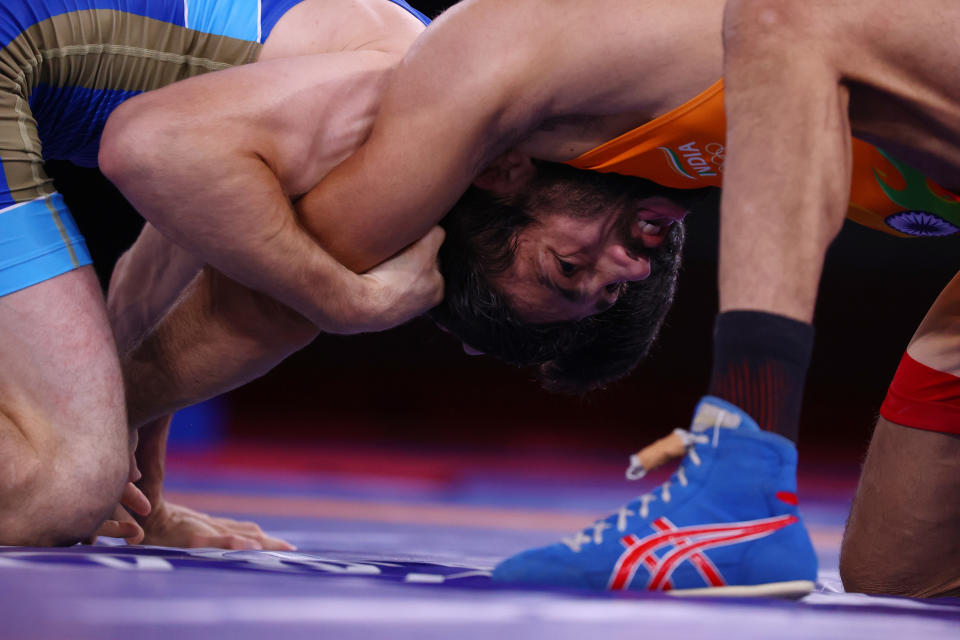 Tokyo 2020 Olympics - Wrestling - Freestyle - Men's 57kg - Gold medal match - Makuhari Messe Hall A, Chiba, Japan - August 5, 2021. Ravi Kumar of India in action against Zavur Uguev of the Russian Olympic Committee. REUTERS/Leah Millis