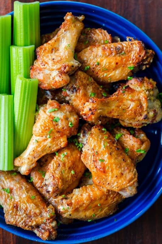 <p>These air fryer chicken wings have crisp salty skin with a hint of garlic and lemon pepper in every bite. These are seasoned to perfection and cook so fast with no marinating required!</p><p><strong>Get the recipe: <a href="https://natashaskitchen.com/air-fryer-chicken-wings/" rel="nofollow noopener" target="_blank" data-ylk="slk:Extra Crispy Air Fryer Chicken Wings;elm:context_link;itc:0;sec:content-canvas" class="link rapid-noclick-resp">Extra Crispy Air Fryer Chicken Wings</a></strong></p>