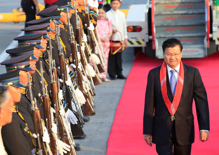 Lao People's Democratic Republic (PDR) Prime Minister Thongloun Sisoulith, reviews honour guards upon arrival at the Manila International airport in Pasay city, metro Manila, Philippines April 28, 2017. REUTERS/Romeo Ranoco