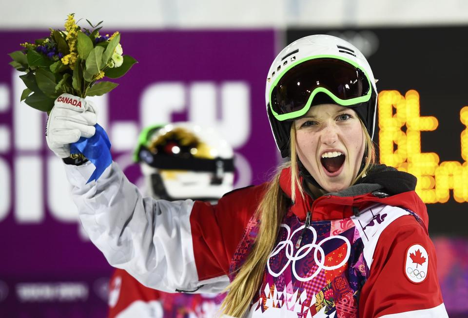 Canada's Justine Dufour-Lapointe celebrates victory after the women's freestyle skiing moguls final competition at the 2014 Sochi Winter Olympic Games in Rosa Khutor, February 8, 2014. REUTERS/Dylan Martinez (RUSSIA - Tags: SPORT OLYMPICS SPORT SKIING TPX IMAGES OF THE DAY)